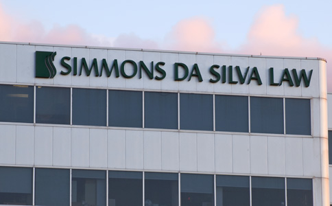 Simmons Da Silva Law Sign on a Building