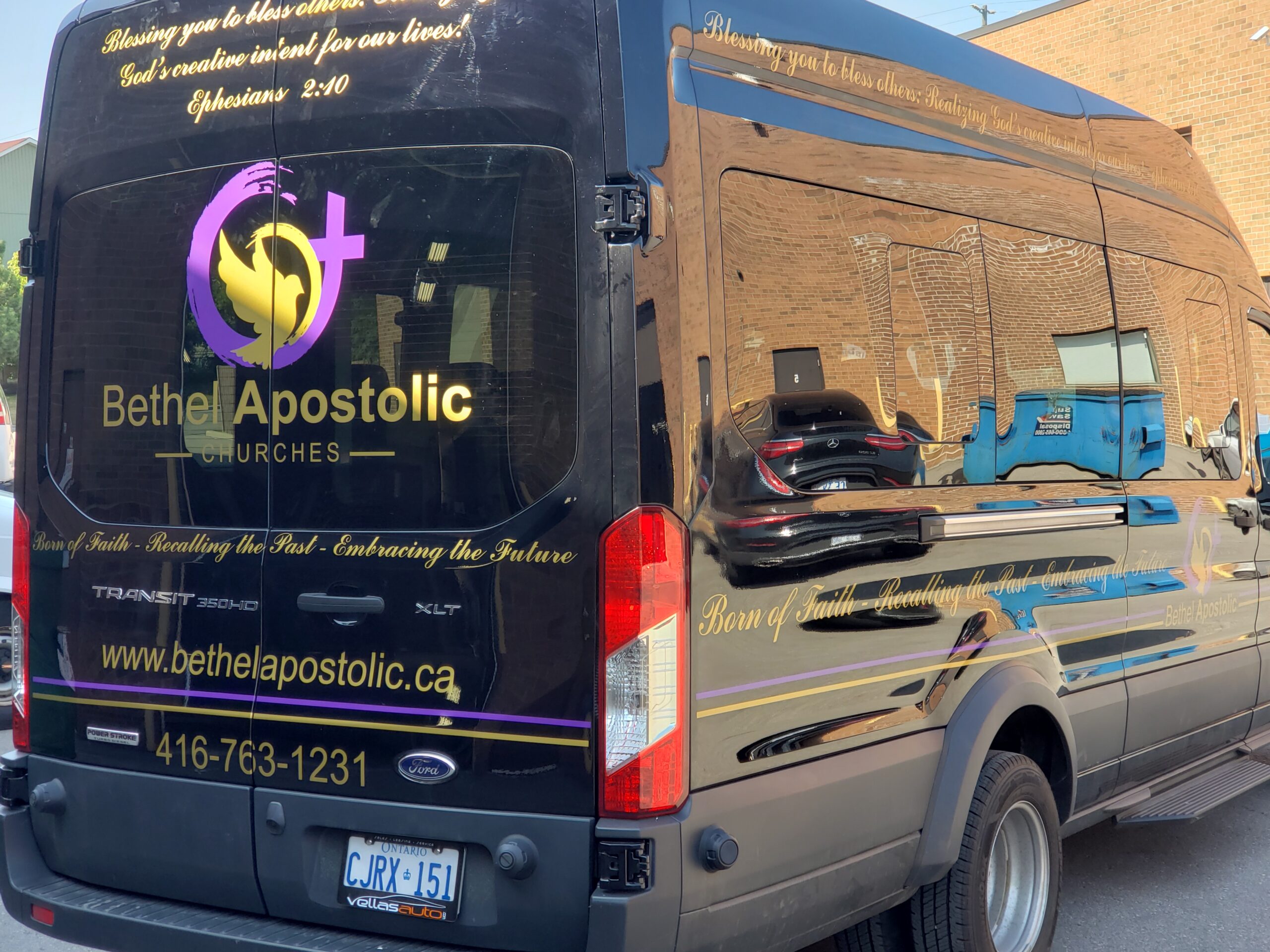 A Black Van Wrapped with Bethel Apostolic's Branded Graphics